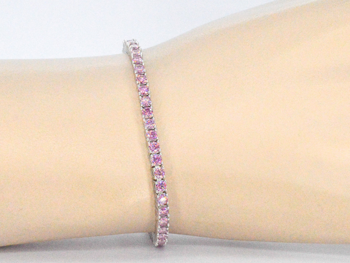 Witte tennisarmband met roze briljanten