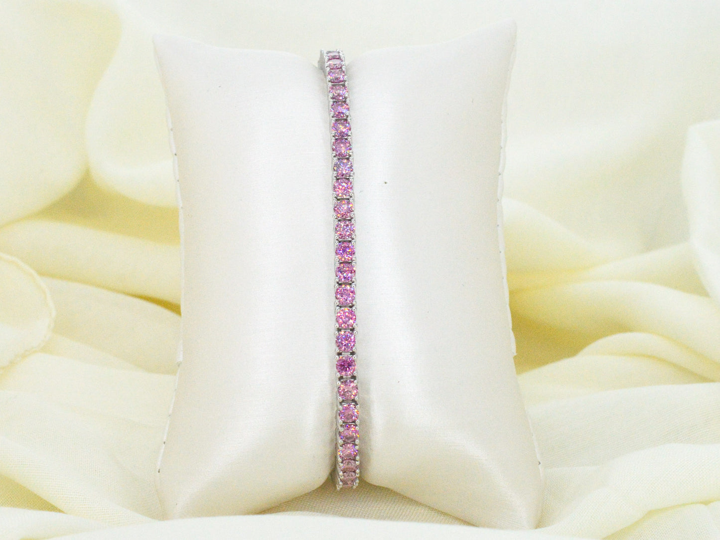 Witte tennisarmband met roze briljanten