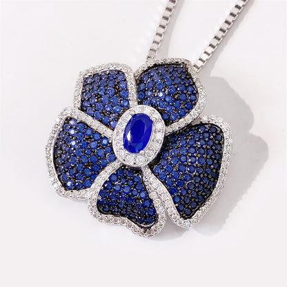 Bloem hanger helemaal vol gezet met blauwe edelstenen en witte briljanten