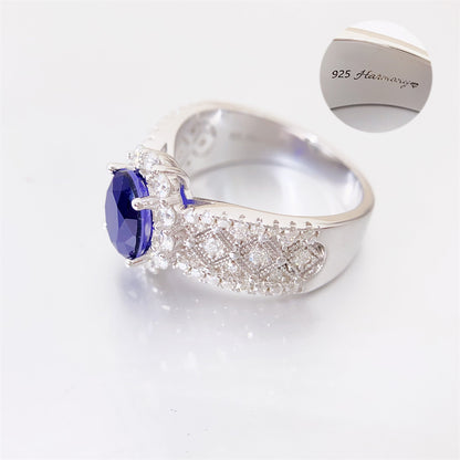 Entourage ring met briljanten en een saffier blauwe ovaal geslepen edelsteen