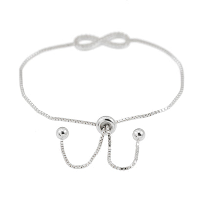Witte armband met infinity symbool rond gezet met briljanten