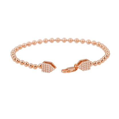 Rosékleurige ronde armband bezet met briljanten
